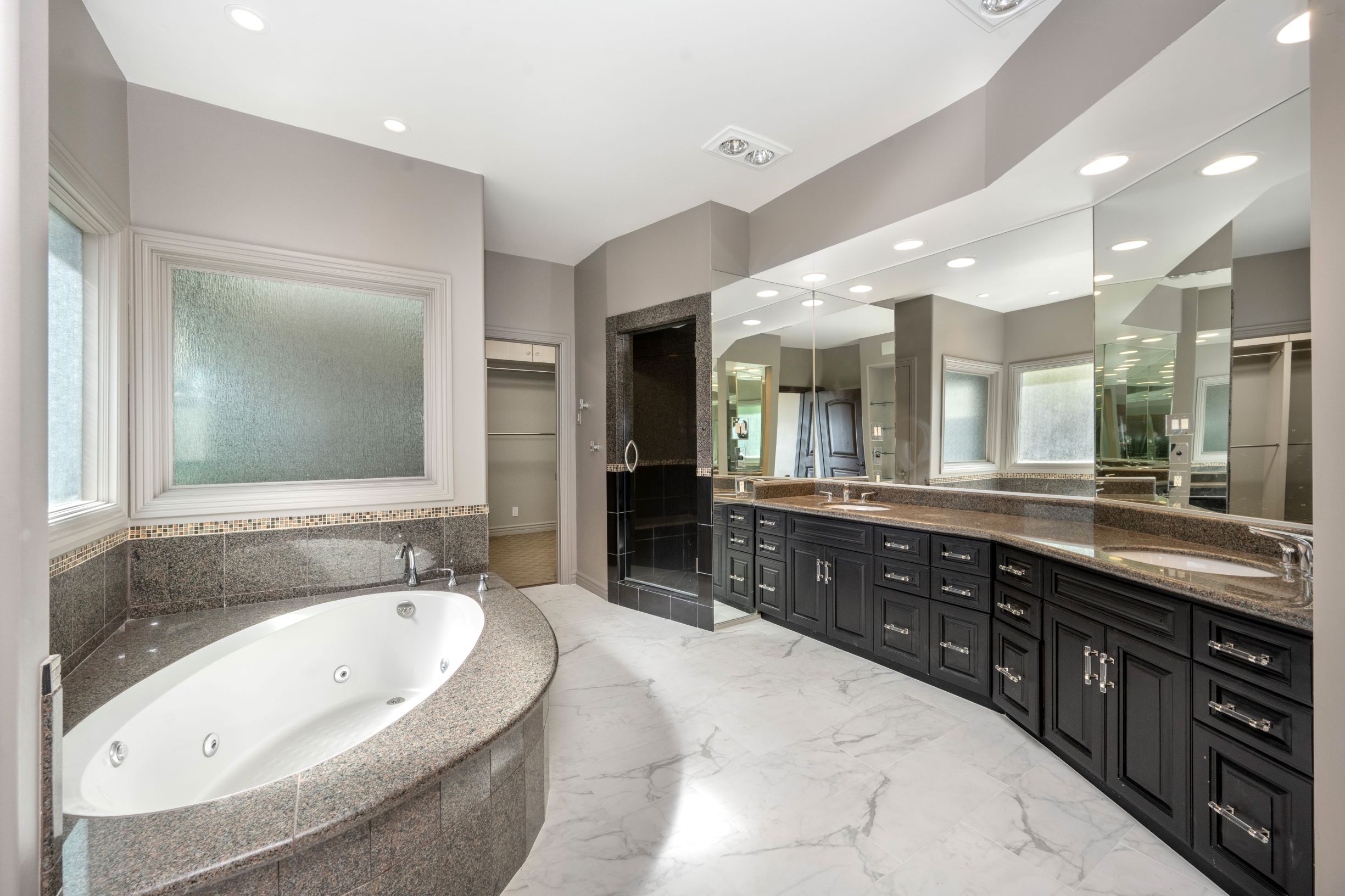 Updated bathroom with full tile shower and modern finishes