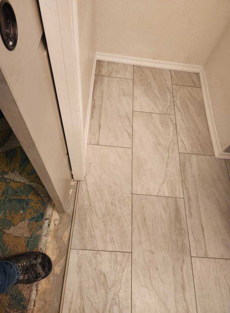 Bathroom tile floor close-up showing installation precision