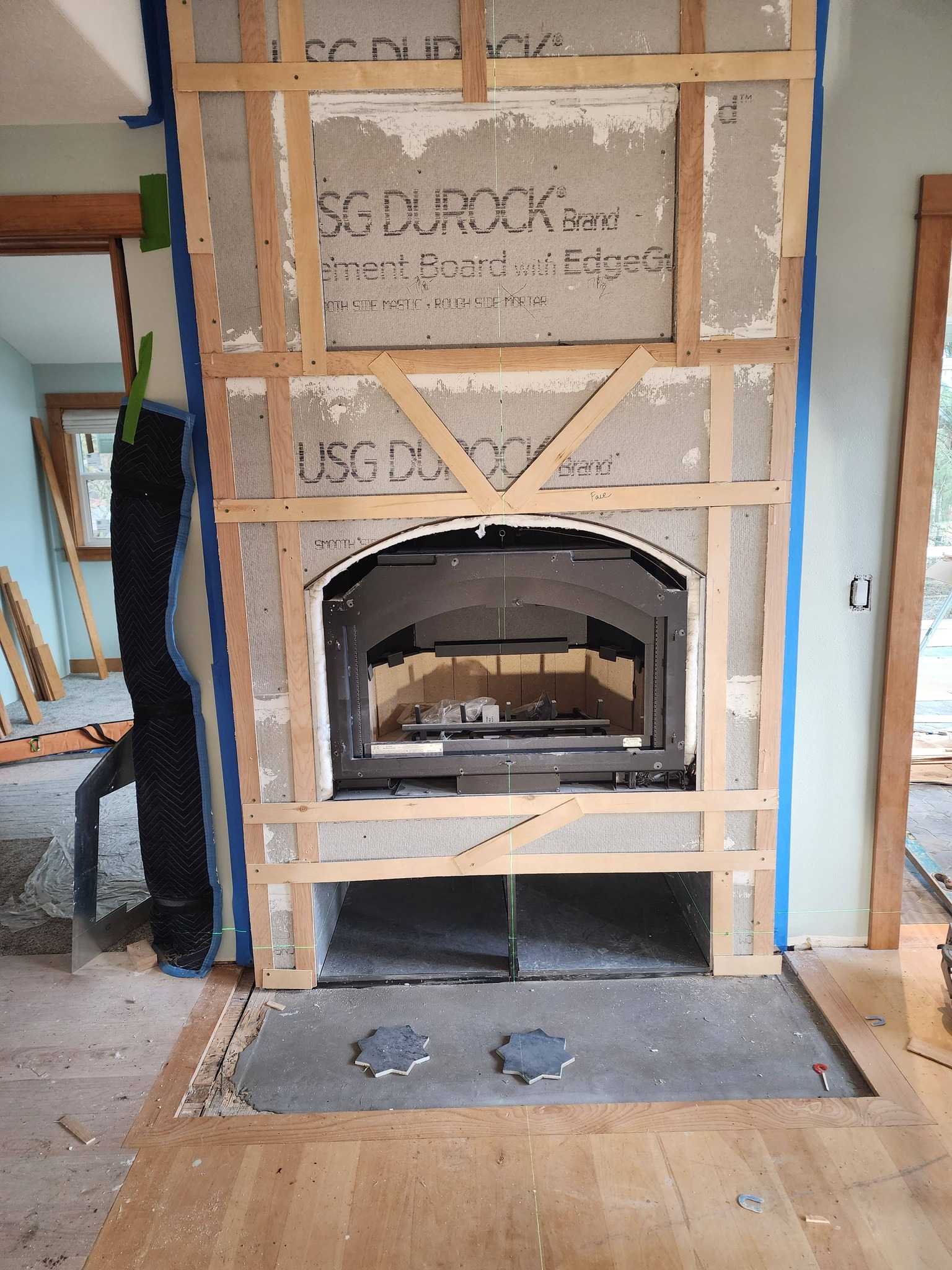 Tile fireplace surround installation with detailed grout work