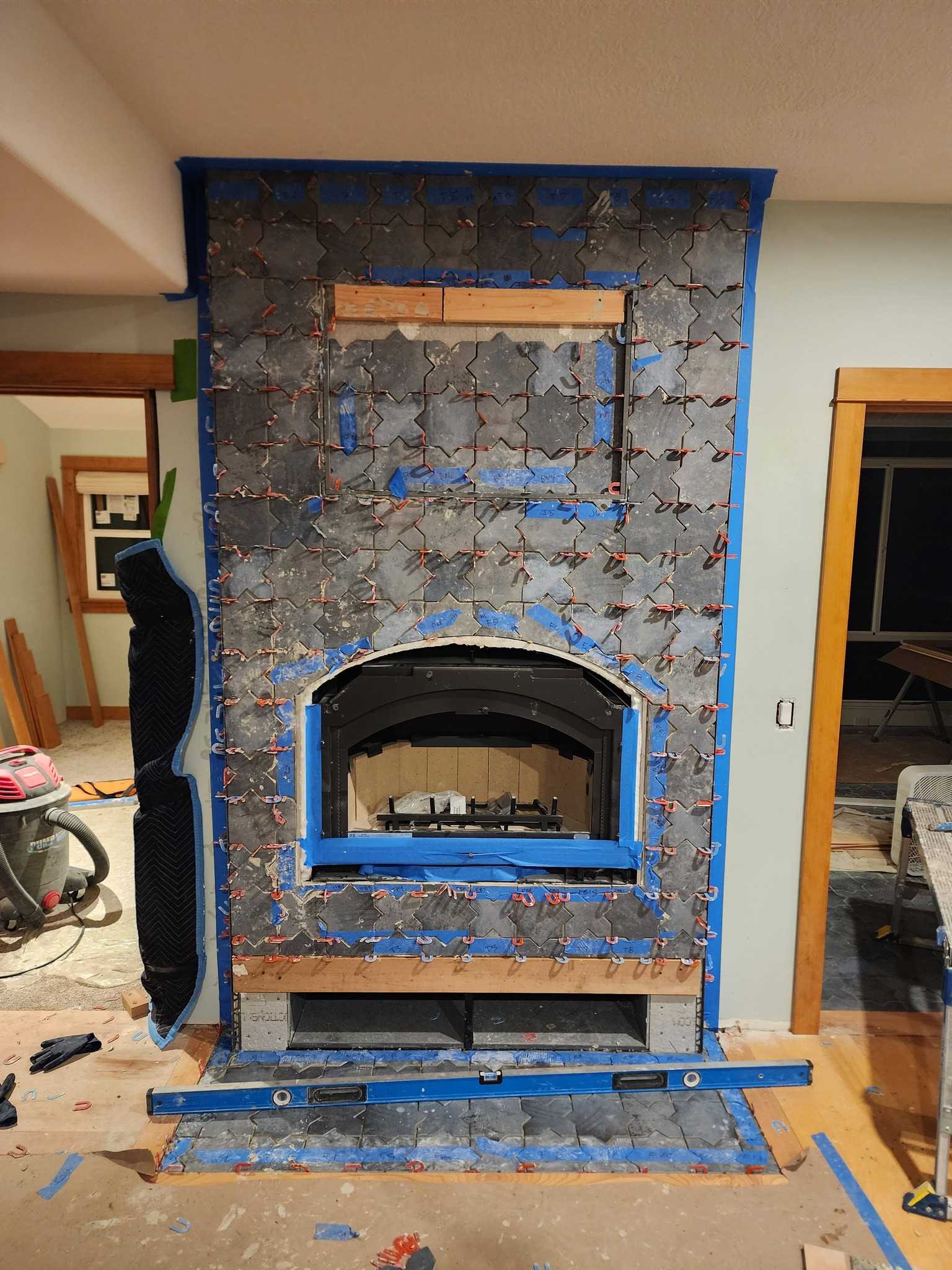Fireplace remodel with custom tile and trim carpentry
