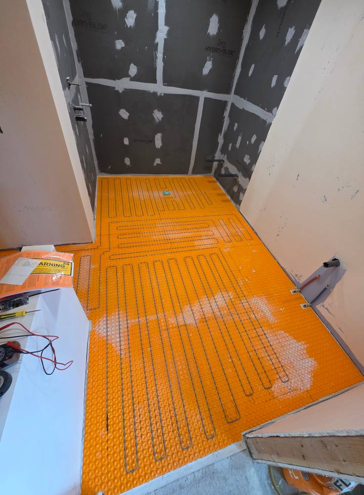 Flooring installation in progress showing planks and clean transitions